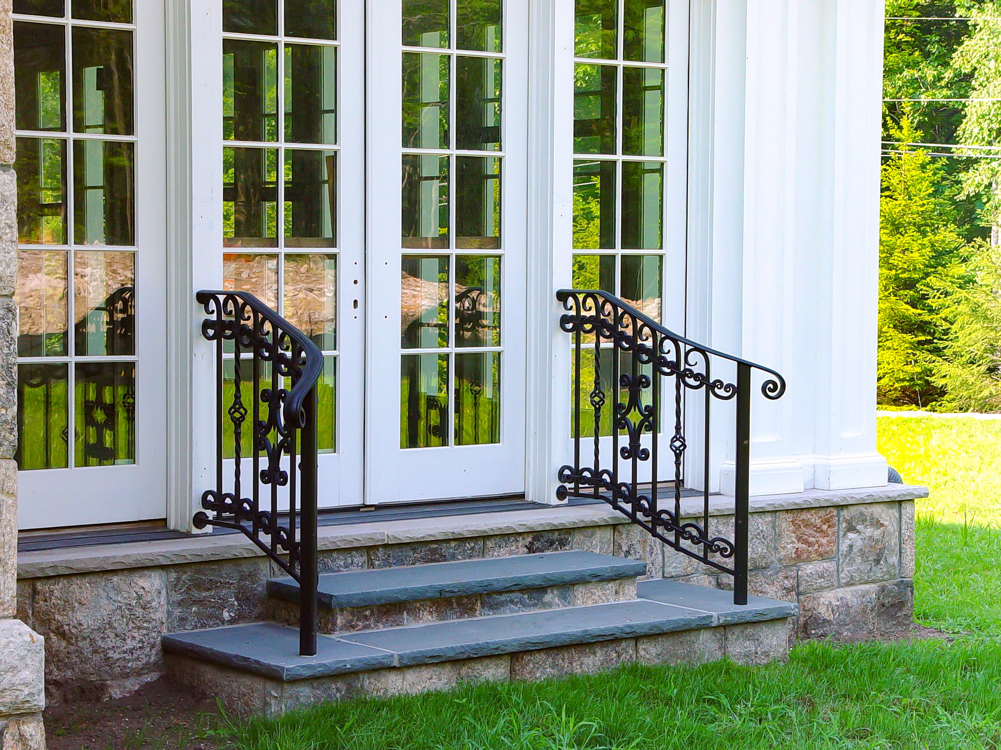 Wrought iron decorative outdoor railing down steps