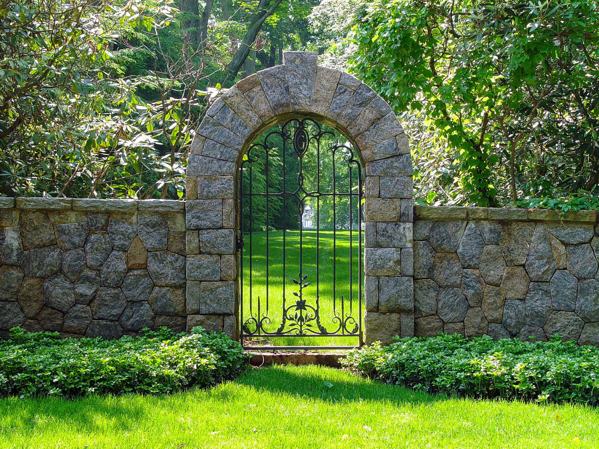 Stone arch metal walk gate